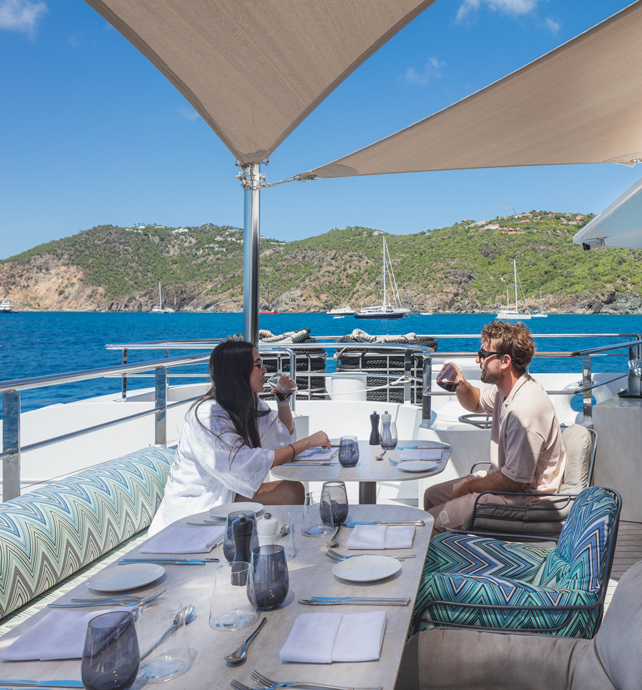 Couple dining at La Cucina Terrace Dining on board Emerald Sakara superyacht in Caribbean