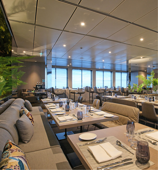 Plush and stylish seating in the La Cucina Dining restaurant, located on board an Emerald Cruises yacht